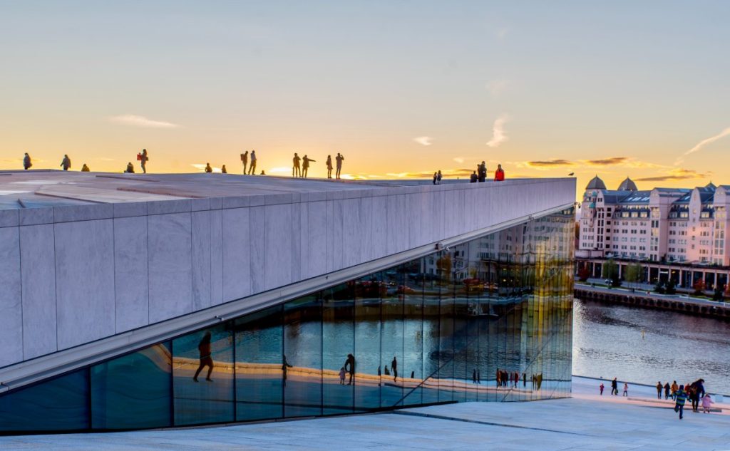 The majestic Opera house, with its slanted roof, offering panoramic views of the city skyline. One of the best reasons to visit oslo