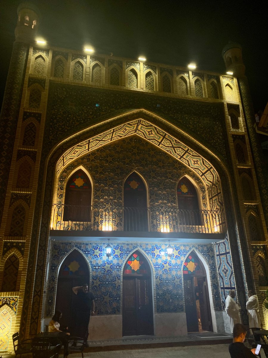 The ornate mosque of tbilisi lit up at night.