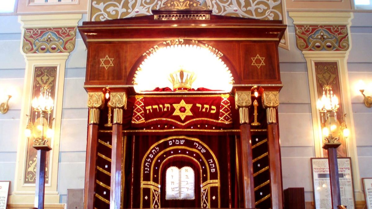 A jewish synagogue with an ornate wooden structure.