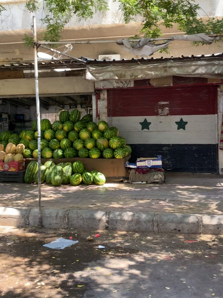 Driving to Damascus, seeing a watermelon seller.