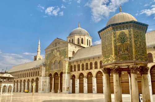 The courtyard of the Umayyad mosque in Damascus, Syria. The golden decorations make it a must-visit