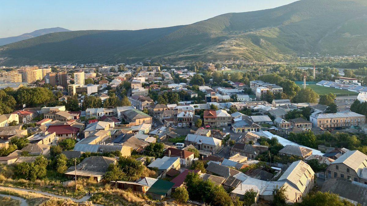 An aerial view of the charming town of Gori with mountains in the background.