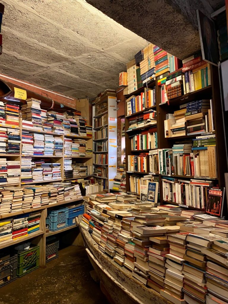 A room full of books at the libreria aqua alta bookstore.