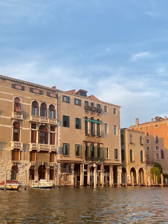 A row of buildings on a canal in venice.