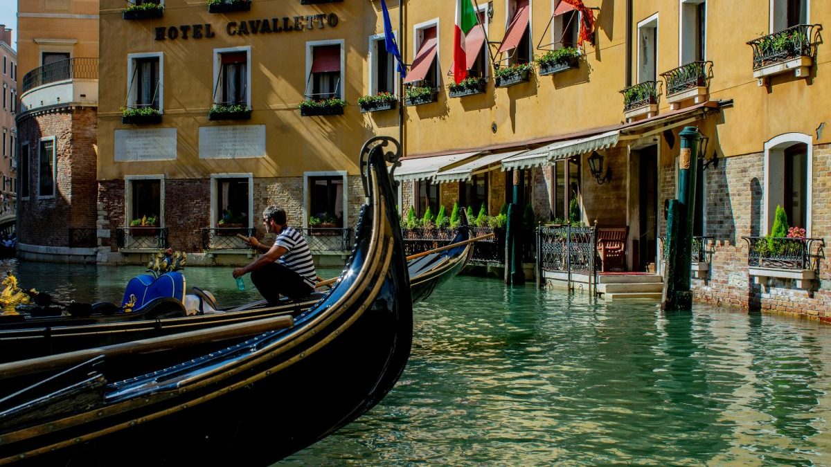 Gondolas on a canal in venice, italy.