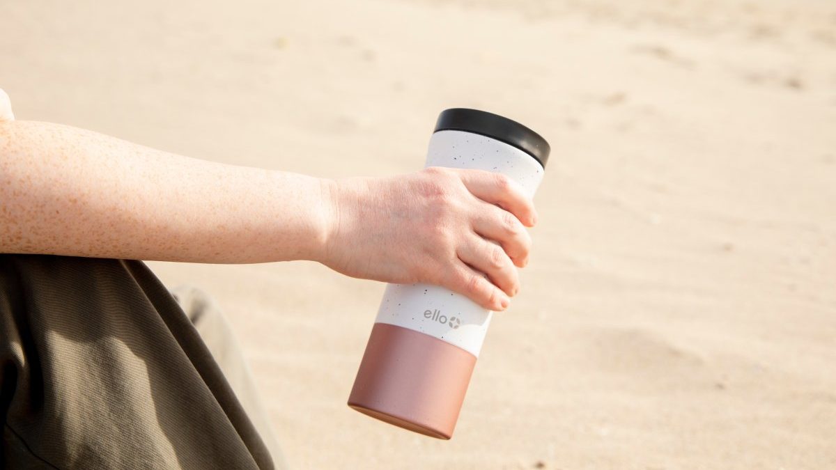 An eco-friendly travel bottle, colored pink and white