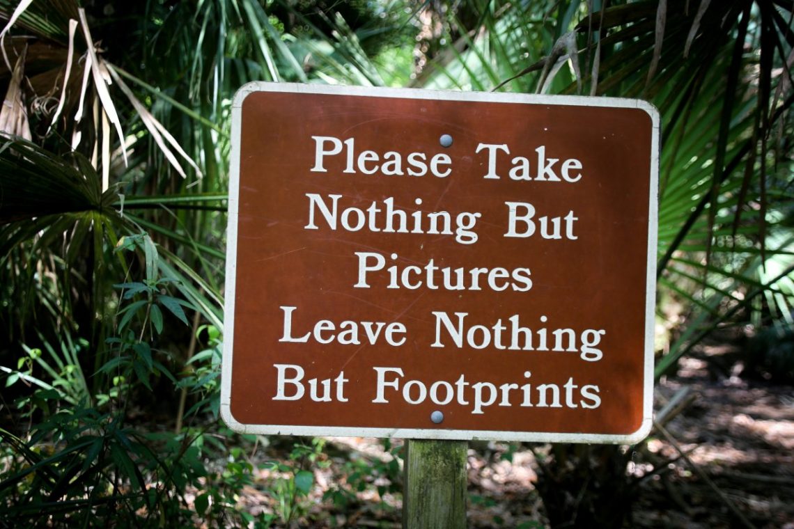 A sign that sais "Please take nothing but pictures, leave nothing but footprints"