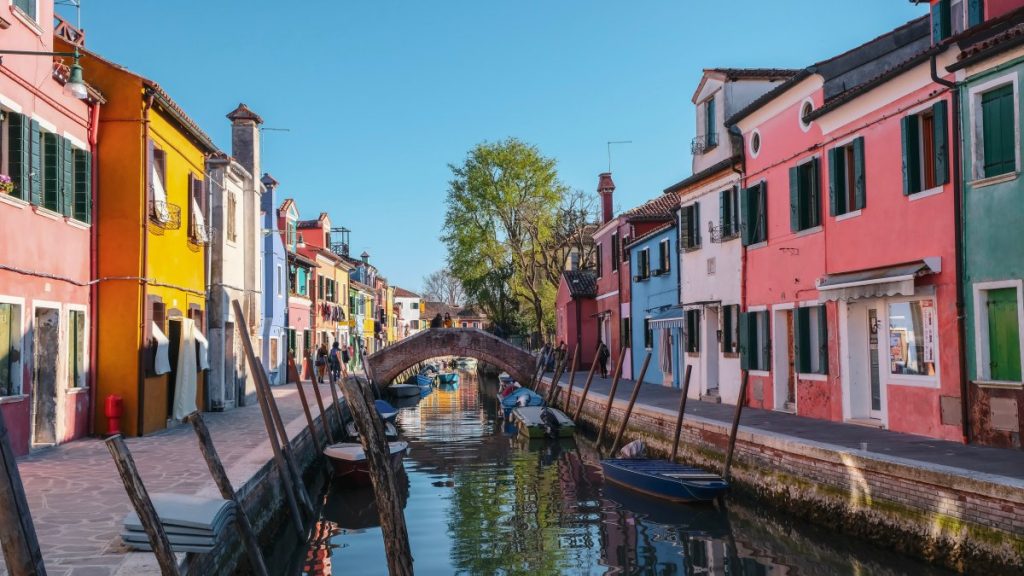Colorful houses on a canal in burano, italy.