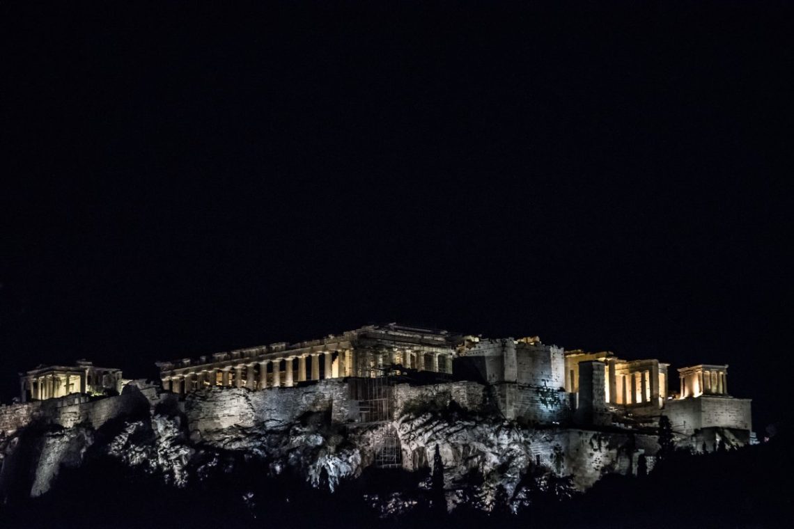 The acropolis standing in the night sky of athens