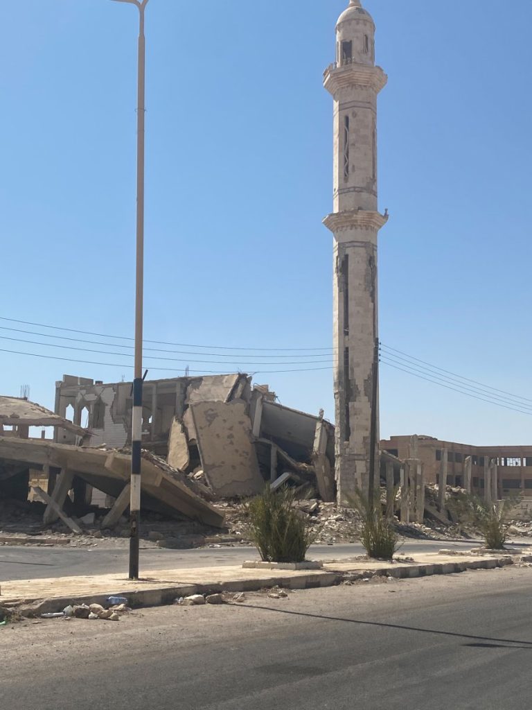 Ruins of a destroyed mosque and a building.