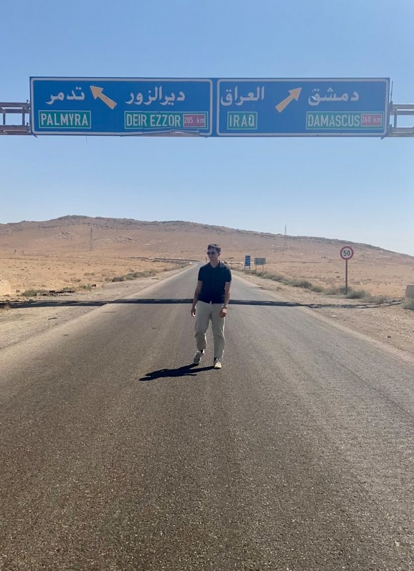 Me, in the middle of a desert road in front of the famous sign.