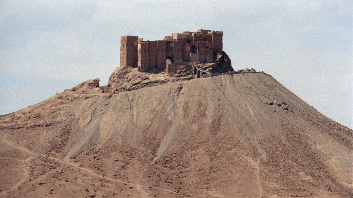 A majestic castle nestled atop a breathtaking mountain in Palmyra.