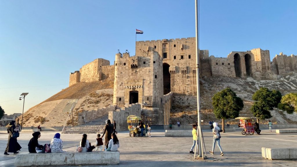 The Aleppo Citadel in the afternoon. Locals gather around to drink coffee and socialize