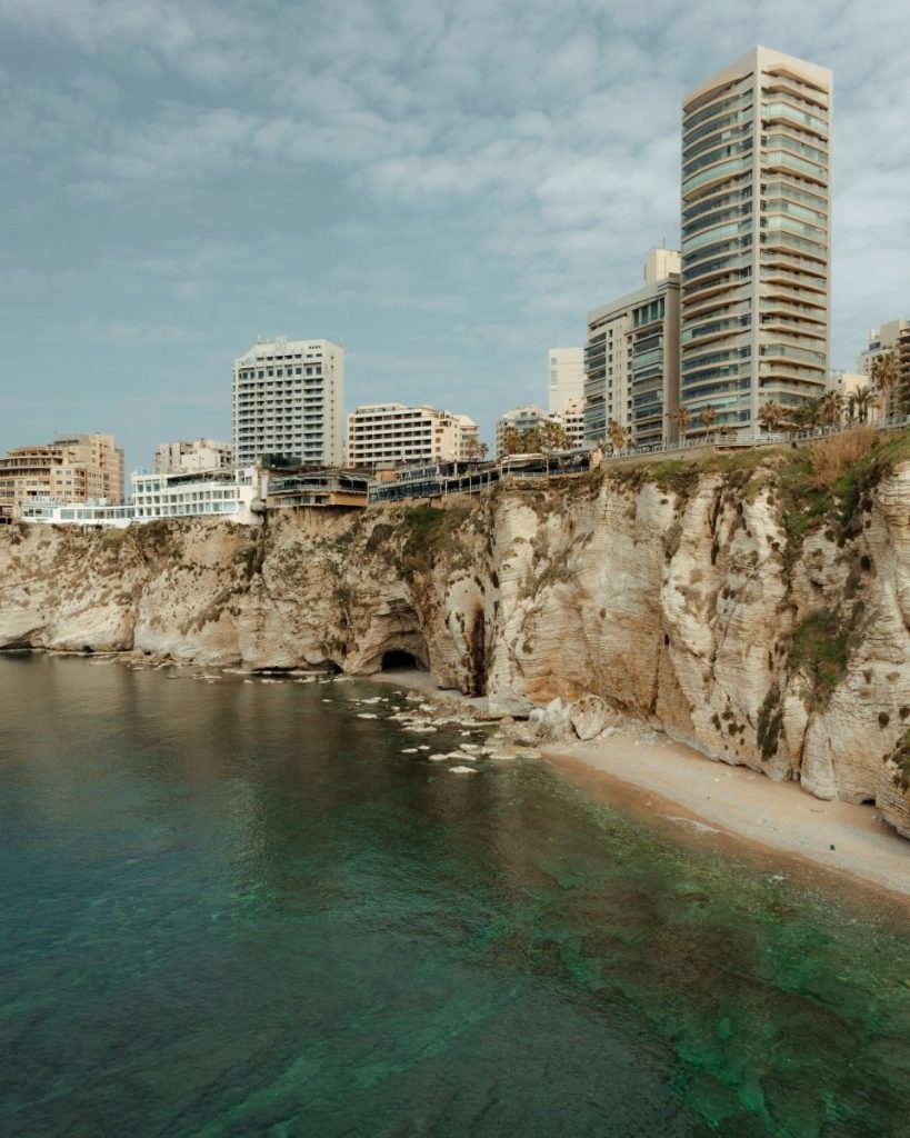 The best travel guide for Beirut: a stunning cliff with ocean views and impressive buildings.