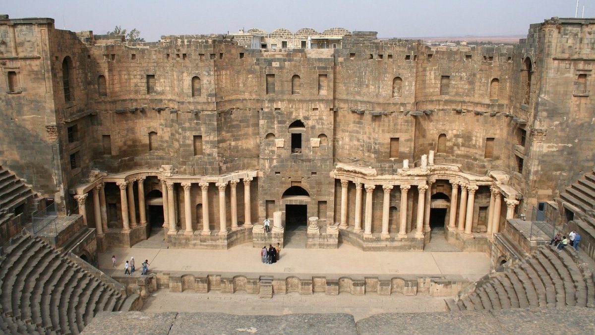 The ruins of an ancient theatre in Bosra, a captivating destination for history enthusiasts and cultural explorers.