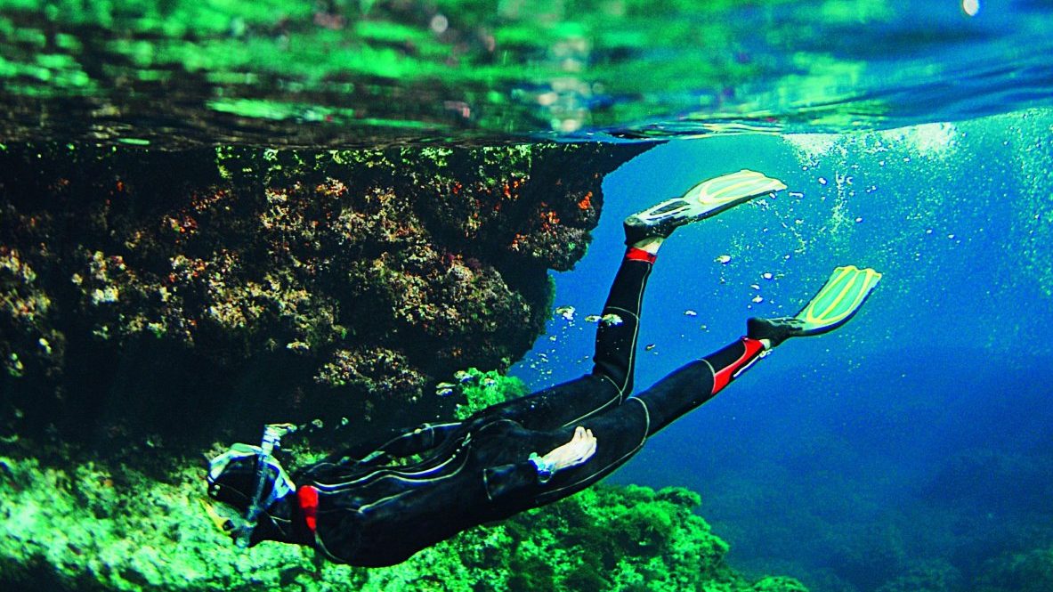 A man scuba diving in the island of Gozo