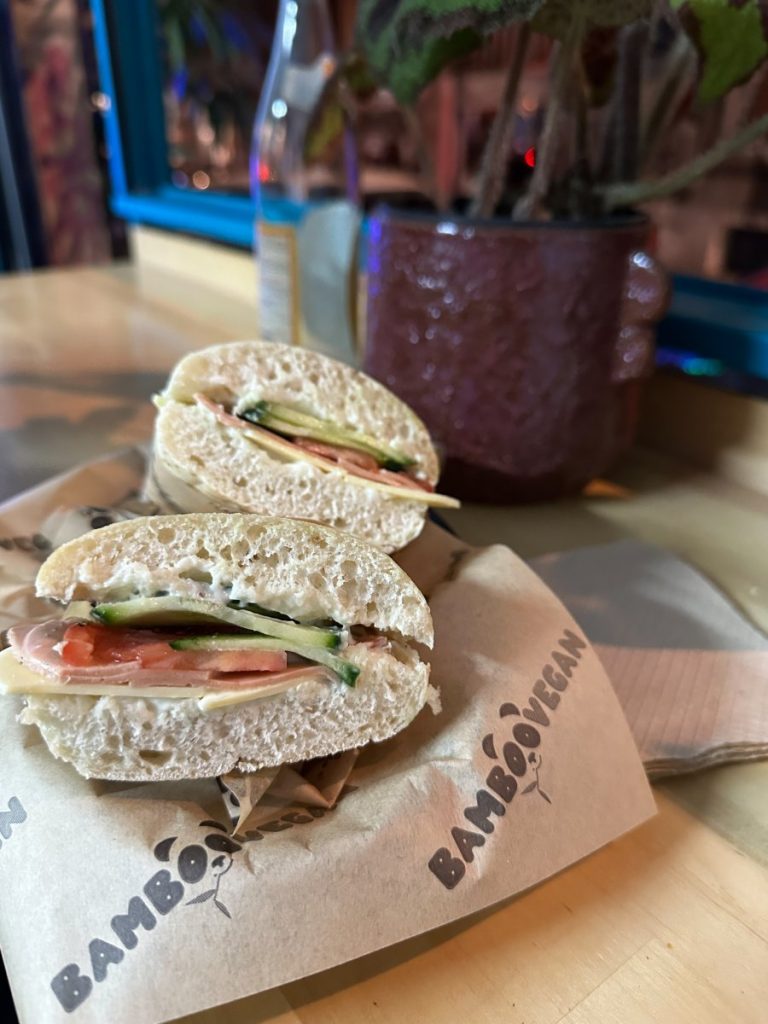 "New York” style sandwich. It includes tofu ham, vegan cheddar, homemade mayo, tomato and cucumber. 