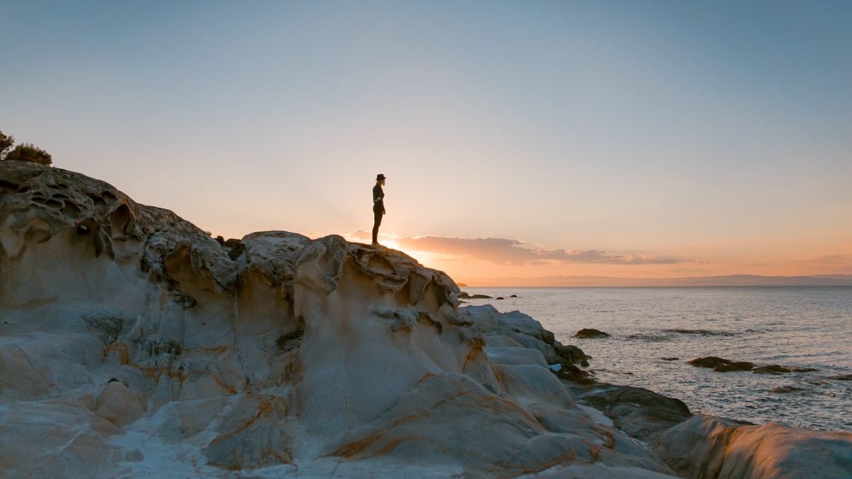 a person looking from a hill