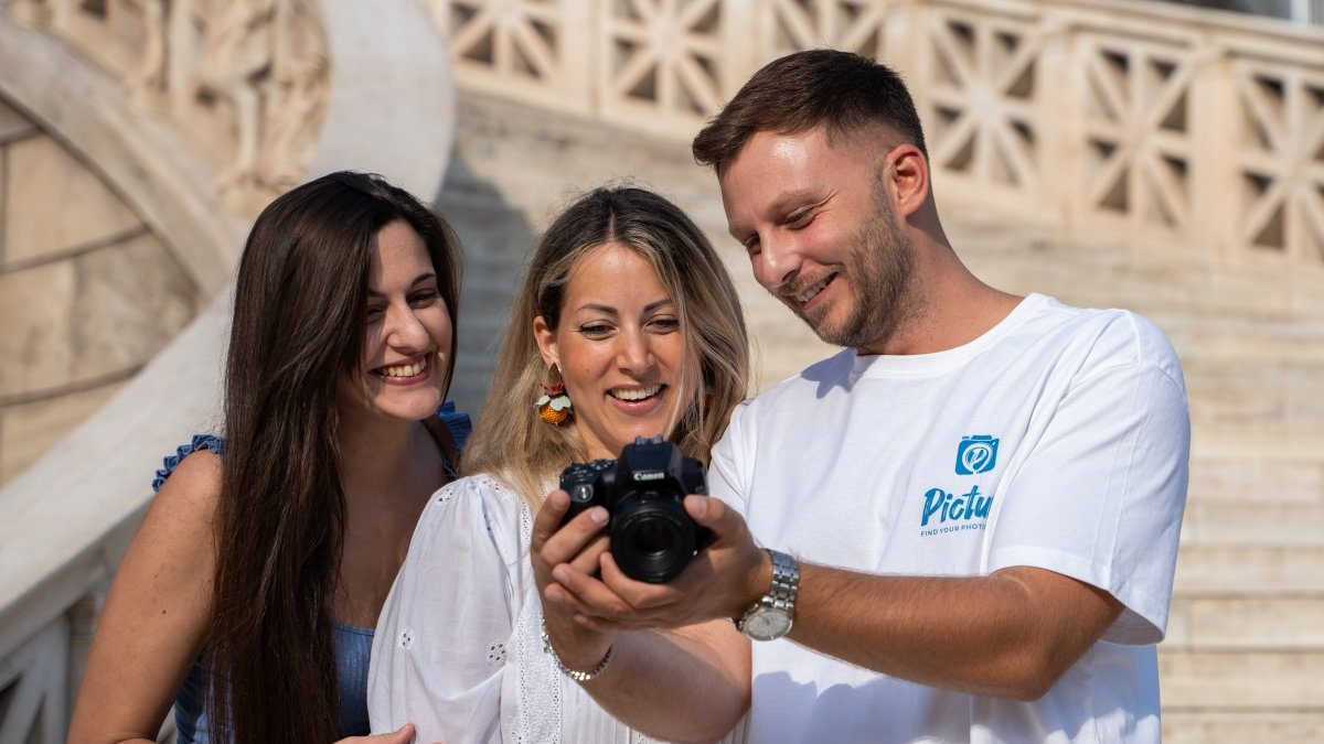 a photographer showing his clients his results