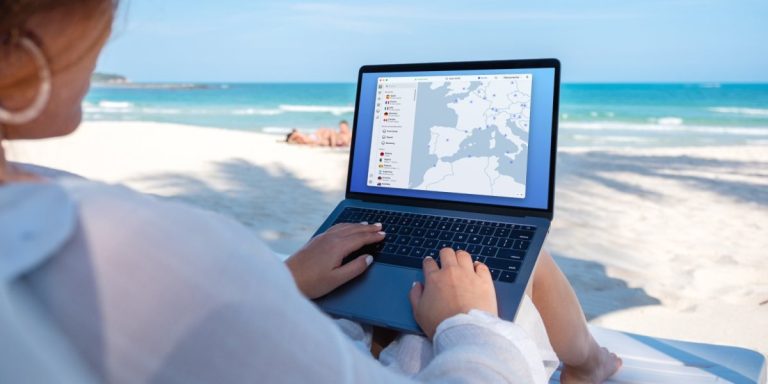 a woman in the Beach Using Nord VPN while traveling