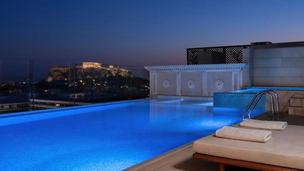 Night Acropolis views from the pool of hotel King George in Athens, Greece