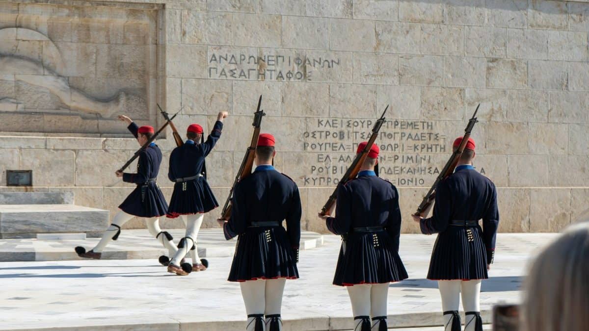 Euzones performing the change of the guard in front of the tomb of the unknown soldier in Syntagma square in Athens.