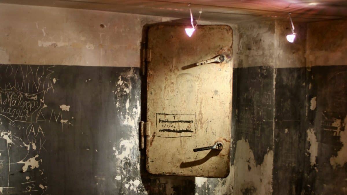 A metal door inside the former torture site.