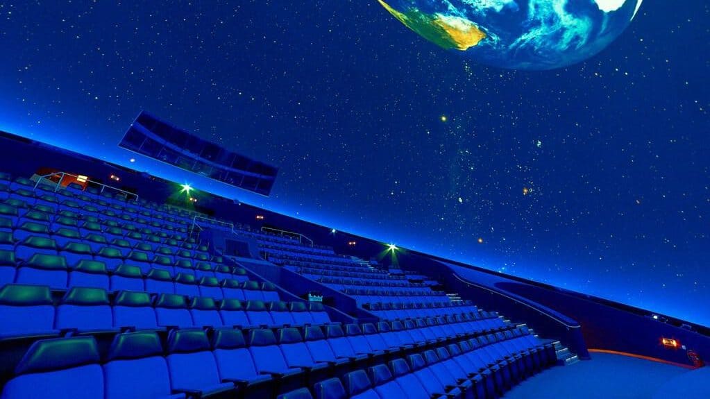 Earth from space with starry sky and stadium lights.